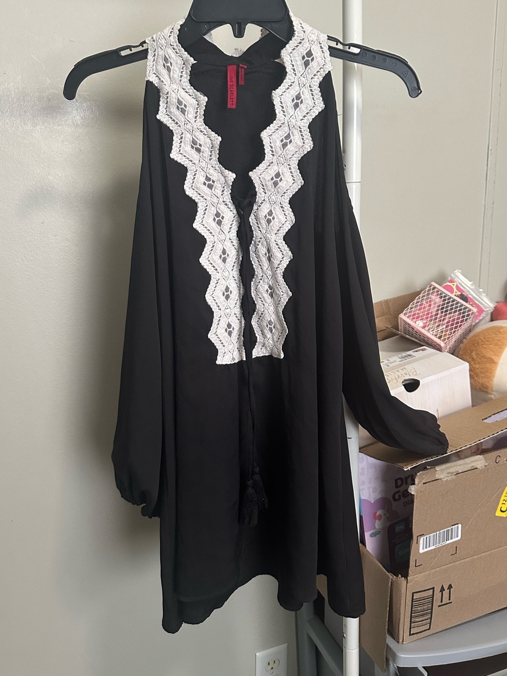 black cold shoulder blouse with white lace trim and tassel tie size medium